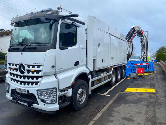 A white vacuum excavator